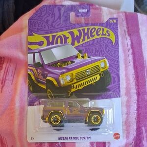 HOT WHEELS 57TH ANNIVERSARY PURPLE AND GOLD PEARL NISSAN PATROL CUSTOM